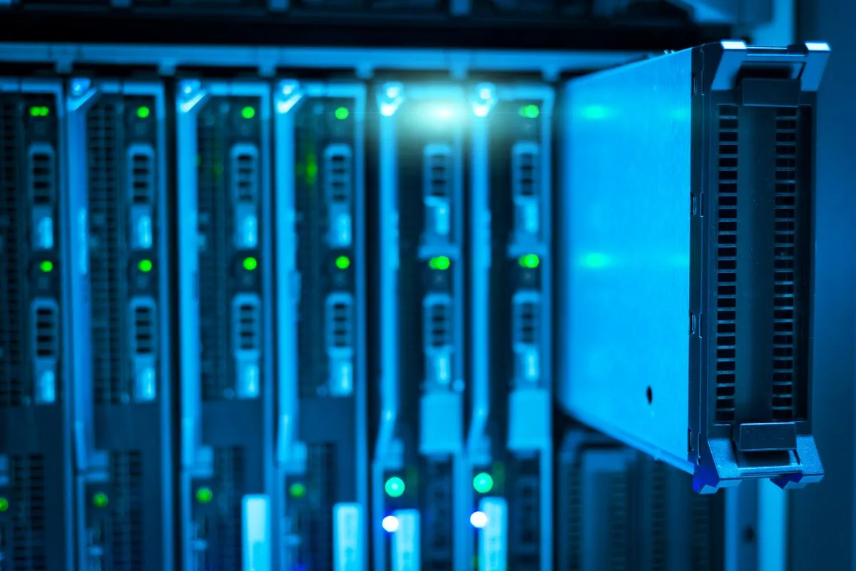 Rows of illuminated servers in a data centre